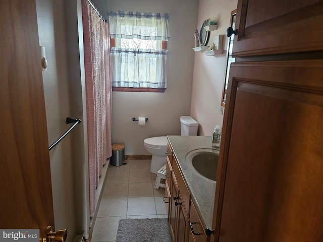 bathroom with vanity, tile patterned floors, and toilet