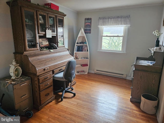 office area featuring a baseboard heating unit, crown molding, and light wood-type flooring