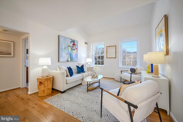 living room with light hardwood / wood-style flooring