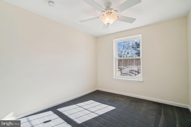 carpeted empty room with ceiling fan