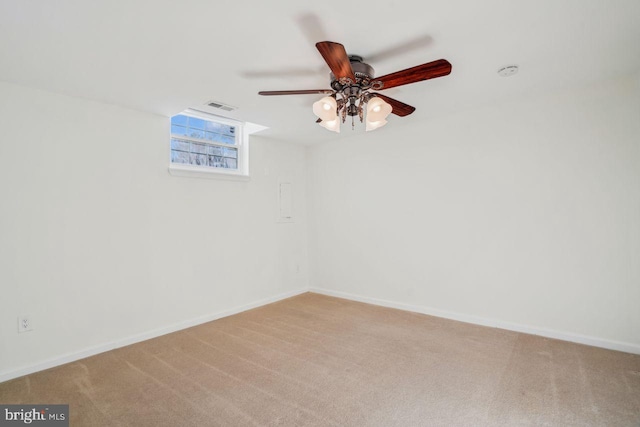 carpeted empty room featuring ceiling fan