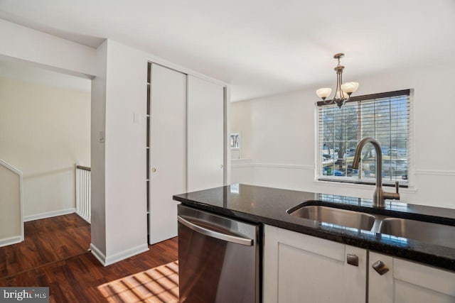 kitchen with sink, dishwasher, hanging light fixtures, dark hardwood / wood-style floors, and white cabinets