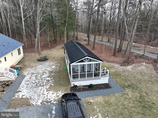 exterior space featuring a sunroom