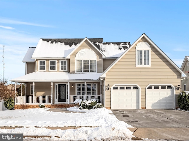 view of front of house with a porch and a garage