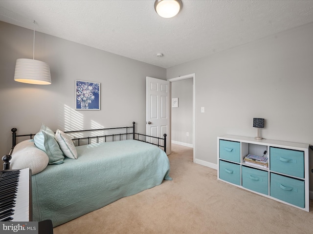 carpeted bedroom with a textured ceiling