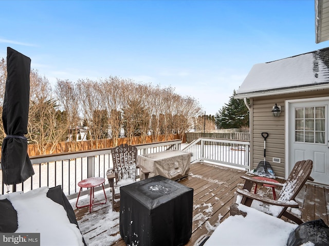 view of snow covered deck