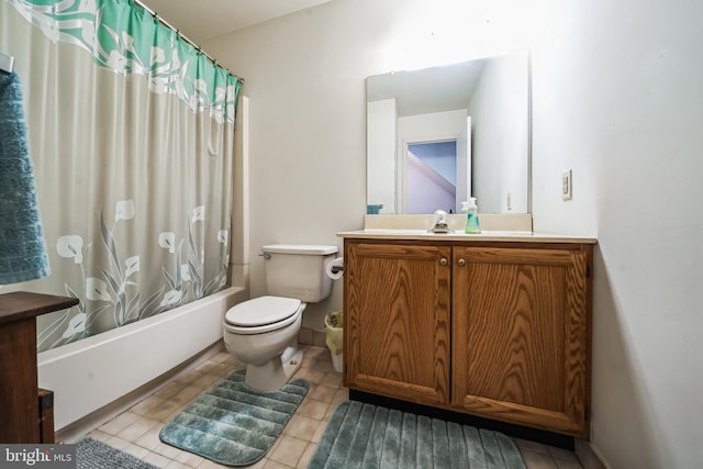 full bathroom with tile patterned floors, vanity, toilet, and shower / bath combo with shower curtain