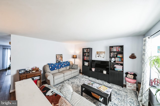 living room with a healthy amount of sunlight and hardwood / wood-style floors