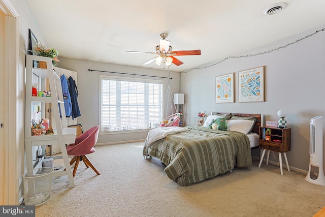 carpeted bedroom with ceiling fan