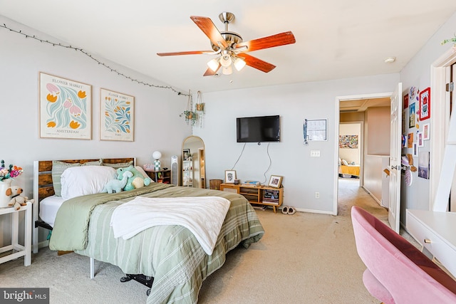 bedroom with light carpet and ceiling fan