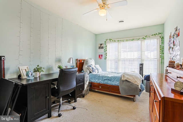 bedroom with ceiling fan and light colored carpet