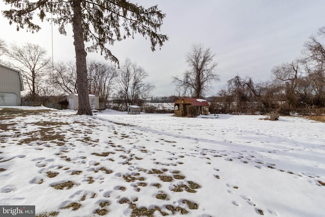 view of yard covered in snow