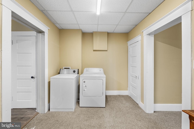 laundry area with washing machine and dryer and carpet floors