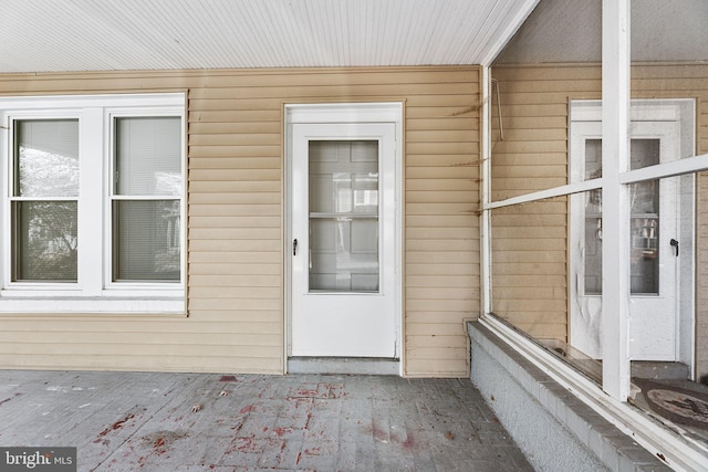 property entrance with a patio area