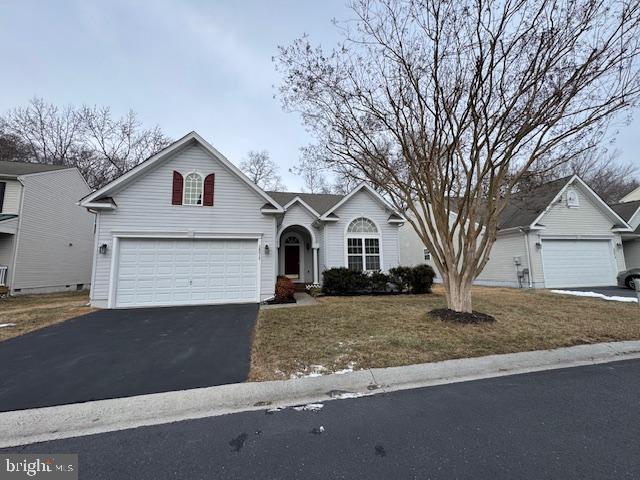 38015 E Chester Ln, Ocean View, DE 19970 - view of front facade with a garage and a front yard