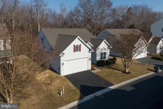 38015 E Chester Ln, Ocean View, DE 19970 - view of front of property featuring a garage and a front lawn