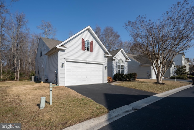 38015 E Chester Ln, Ocean View, DE 19970 - front facade featuring a garage, central air condition unit, and a front lawn