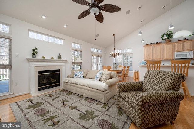 38015 E Chester Ln, Ocean View, DE 19970 - living room featuring high vaulted ceiling, plenty of natural light, and light hardwood / wood-style floors
