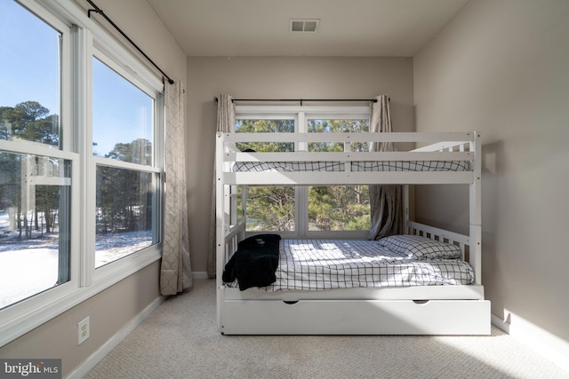 bedroom featuring light colored carpet