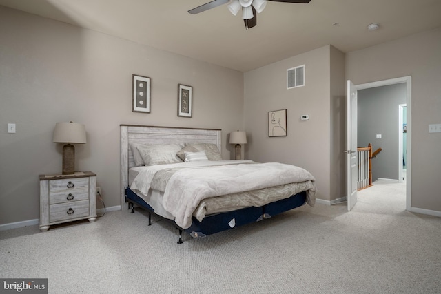 bedroom featuring ceiling fan and light carpet