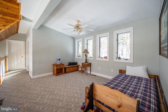 carpeted bedroom featuring vaulted ceiling and ceiling fan