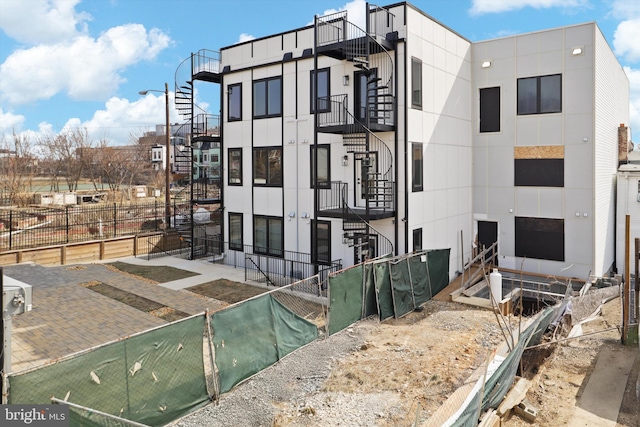 757 Columbia Rd NW, Washington, DC 20001 - view of front of home with stucco siding, fence, and stairs