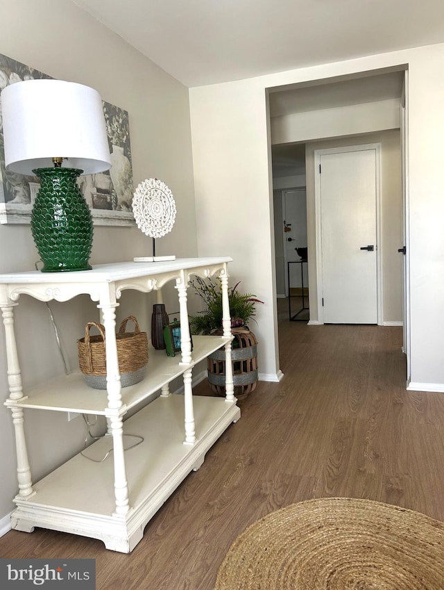 hall with dark wood-type flooring