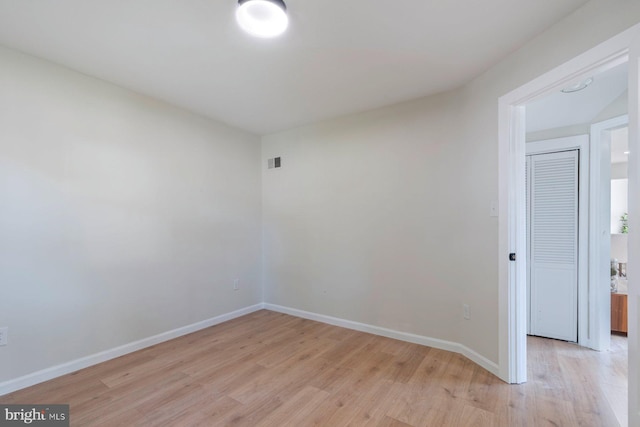 spare room with light wood-type flooring