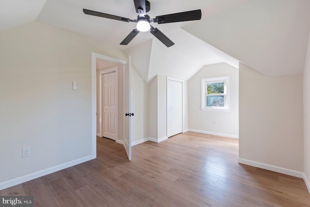 additional living space featuring ceiling fan, vaulted ceiling, and light hardwood / wood-style flooring