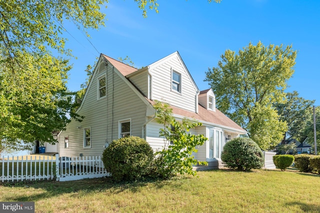 view of home's exterior featuring a yard