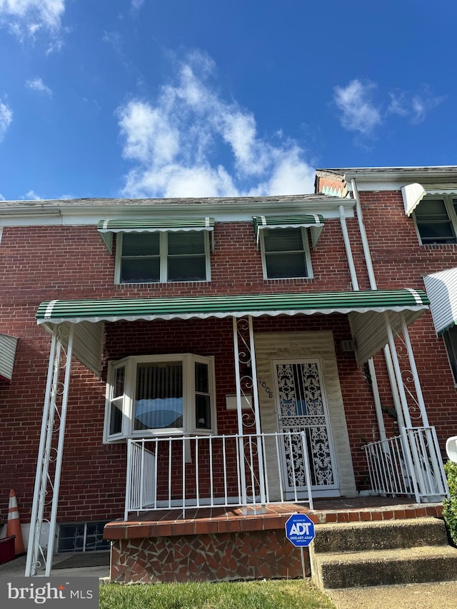 view of property with a porch