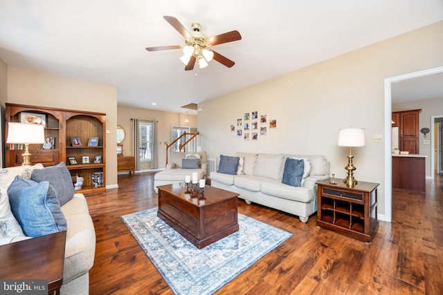 living room featuring dark hardwood / wood-style floors and ceiling fan