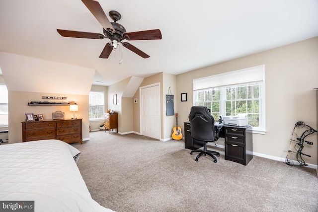 bedroom with multiple windows, carpet floors, ceiling fan, and a closet