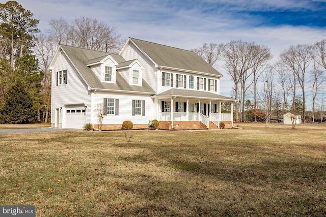 view of front of house with a garage, covered porch, and a front lawn