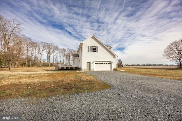 view of side of property with a garage