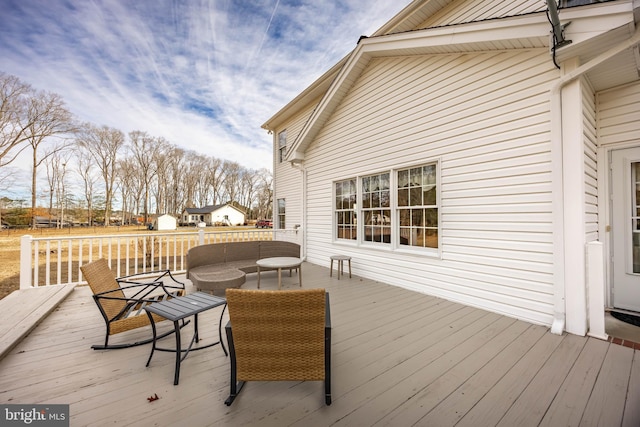 deck featuring outdoor lounge area