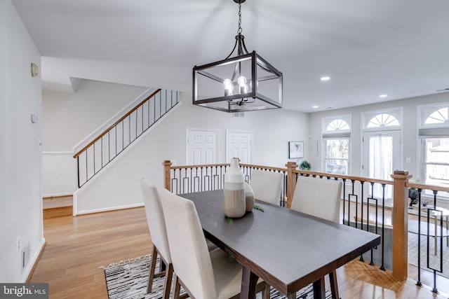 dining space featuring visible vents, recessed lighting, light wood finished floors, baseboards, and a chandelier