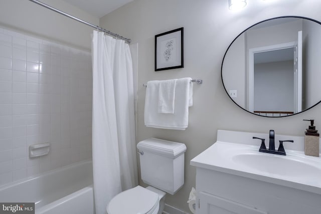 full bathroom with vanity, shower / tub combo, and toilet