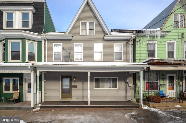 townhome / multi-family property with covered porch