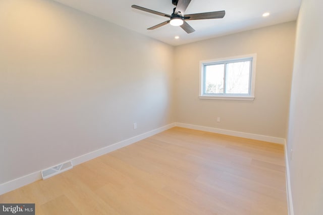 spare room with ceiling fan and light hardwood / wood-style flooring