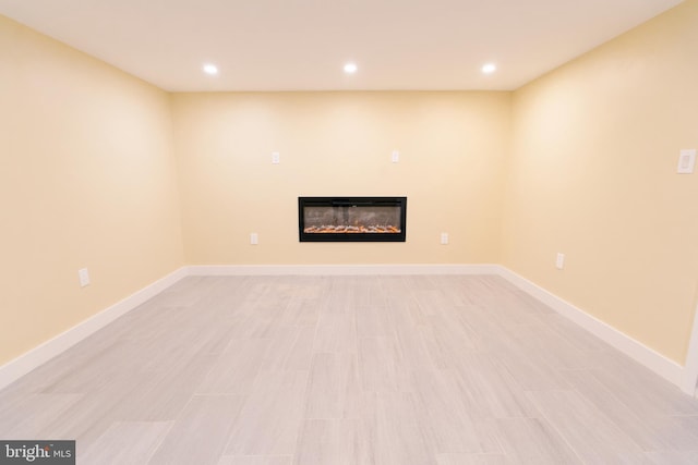 basement featuring light wood-type flooring