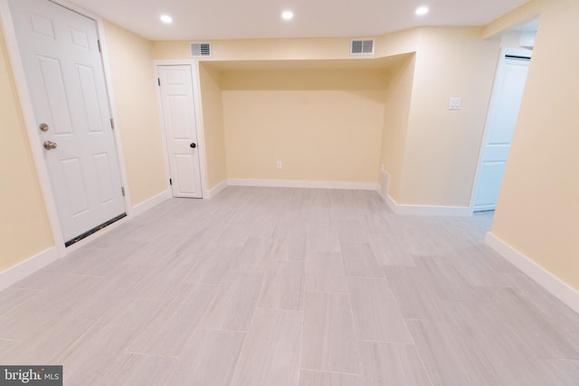 basement featuring light hardwood / wood-style flooring