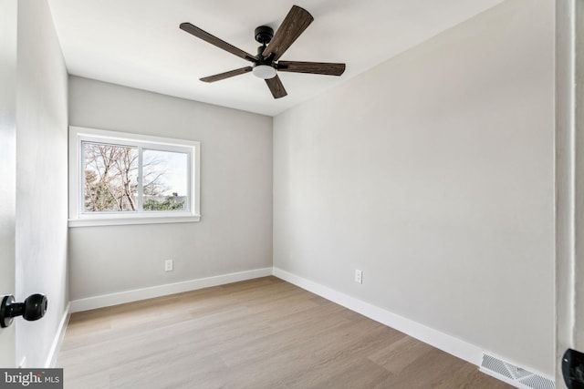 unfurnished room featuring light hardwood / wood-style floors and ceiling fan