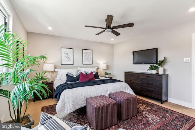 bedroom featuring ceiling fan and light wood-type flooring