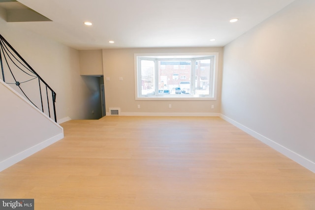 unfurnished living room with light wood-type flooring