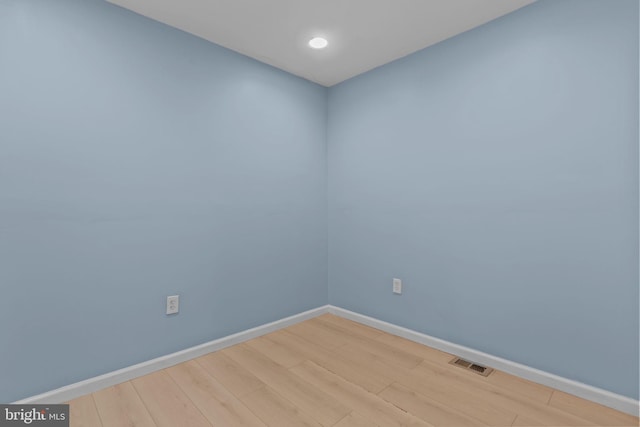 unfurnished room featuring light hardwood / wood-style floors