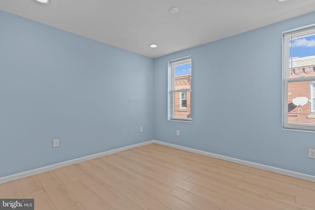 empty room with light wood-type flooring