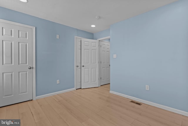 unfurnished bedroom featuring light hardwood / wood-style flooring