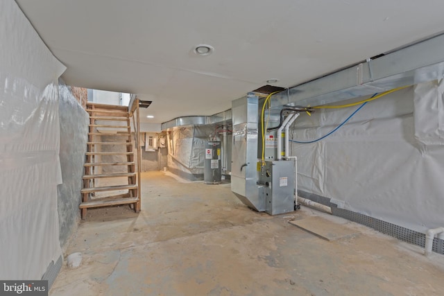 basement with electric water heater and heating unit