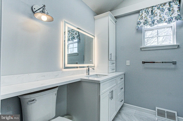 bathroom featuring vanity, baseboards, visible vents, toilet, and marble finish floor